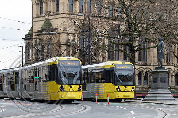 5849A - 3064 and 3117 pass outside Manchester Town Hall 26022017